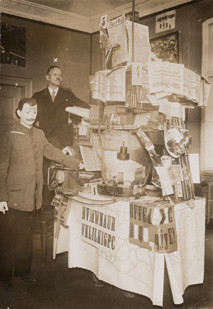 Lot 4118, Auction  121, Dada Berlin, Johannes Baader next to his object "Germany's Greatness and Decline" at the opening of the "Erste Internationale Dada-Messe" held at the Otto Burchard Gallery, Berlin