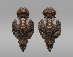 Lot 6030, Auction  125, Deutsch, 17. oder 19. Jh. Zwei Konsolen mit je einem Seraphim über einer Blattmaske mit Rollwerk.