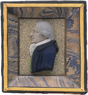 Lot 6309, Auction  125, Deutsch, Ende 18. Jh. Miniatur Wachs Portrait eines Mannes mit Perücke und blauer Jacke im Profil nach links